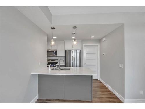 282 Seton Passage Se, Calgary, AB - Indoor Photo Showing Kitchen With Stainless Steel Kitchen With Double Sink With Upgraded Kitchen