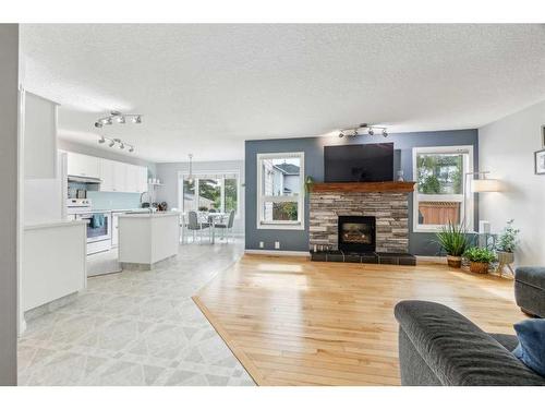 70 Mt Brewster Circle Se, Calgary, AB - Indoor Photo Showing Living Room With Fireplace