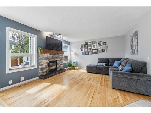 70 Mt Brewster Circle Se, Calgary, AB - Indoor Photo Showing Living Room With Fireplace