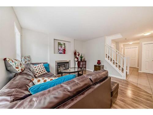 161 Silverado Range View, Calgary, AB - Indoor Photo Showing Living Room With Fireplace