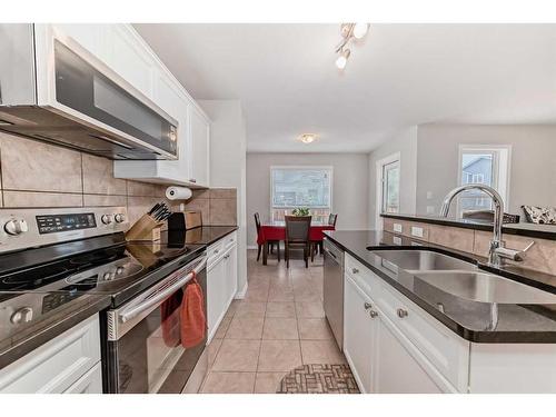 161 Silverado Range View, Calgary, AB - Indoor Photo Showing Kitchen With Double Sink