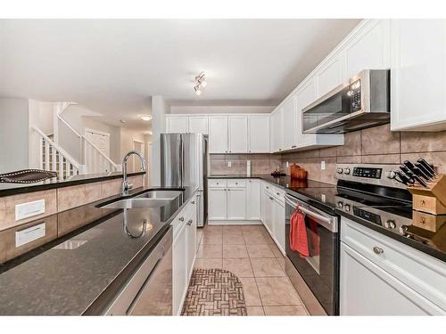 161 Silverado Range View, Calgary, AB - Indoor Photo Showing Kitchen With Double Sink With Upgraded Kitchen