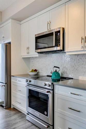 408-150 Auburn Meadows Manor Se, Calgary, AB - Indoor Photo Showing Kitchen With Stainless Steel Kitchen With Upgraded Kitchen