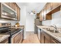 406-635 56 Avenue Sw, Calgary, AB  - Indoor Photo Showing Kitchen With Double Sink 