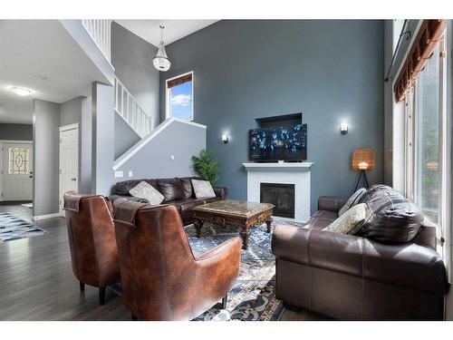 1413 Kings Heights Boulevard Se, Airdrie, AB - Indoor Photo Showing Living Room With Fireplace