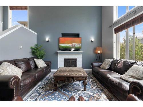 1413 Kings Heights Boulevard Se, Airdrie, AB - Indoor Photo Showing Living Room With Fireplace