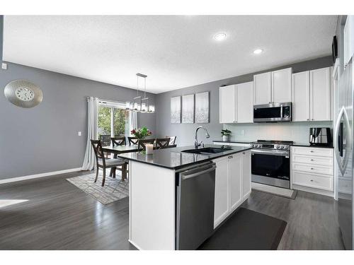 1413 Kings Heights Boulevard Se, Airdrie, AB - Indoor Photo Showing Kitchen With Stainless Steel Kitchen With Upgraded Kitchen