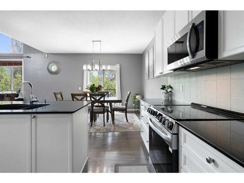 1413 Kings Heights Boulevard Se, Airdrie, AB - Indoor Photo Showing Kitchen With Upgraded Kitchen