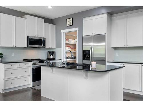 1413 Kings Heights Boulevard Se, Airdrie, AB - Indoor Photo Showing Kitchen With Double Sink With Upgraded Kitchen