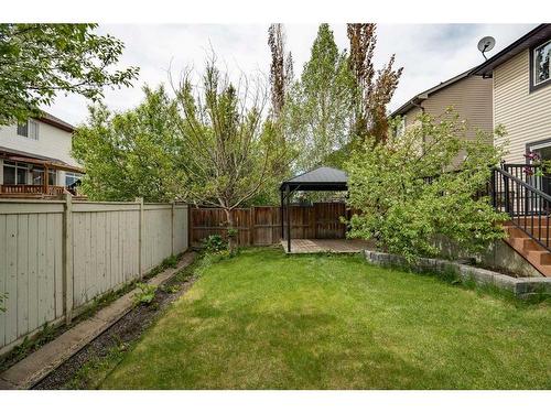 1413 Kings Heights Boulevard Se, Airdrie, AB - Outdoor With Backyard