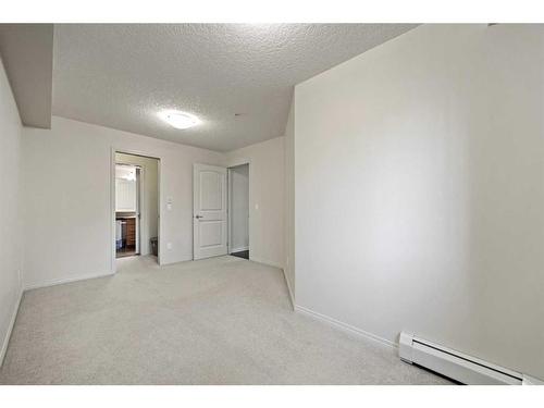 2212-175 Panatella Hill Nw, Calgary, AB - Indoor Photo Showing Other Room