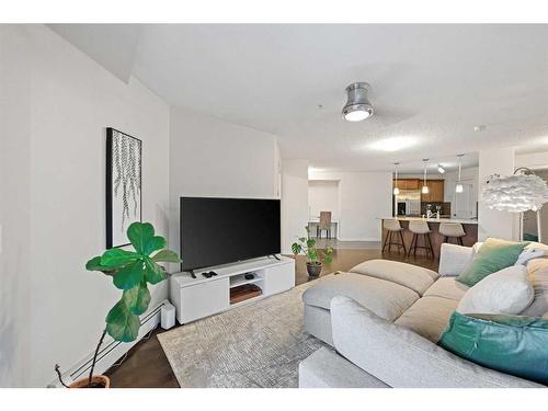 2212-175 Panatella Hill Nw, Calgary, AB - Indoor Photo Showing Living Room