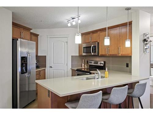 2212-175 Panatella Hill Nw, Calgary, AB - Indoor Photo Showing Kitchen With Double Sink With Upgraded Kitchen