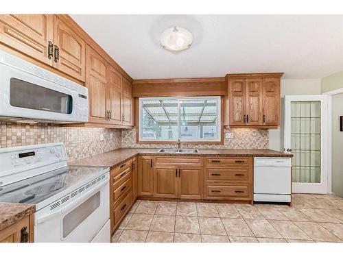 9216 Allison Drive Se, Calgary, AB - Indoor Photo Showing Kitchen With Double Sink