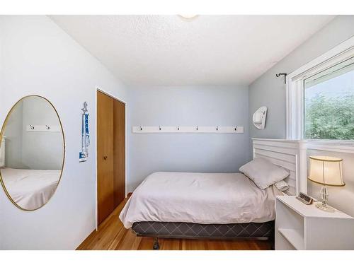 9216 Allison Drive Se, Calgary, AB - Indoor Photo Showing Bedroom