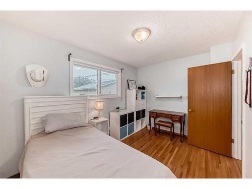 9216 Allison Drive Se, Calgary, AB - Indoor Photo Showing Bedroom