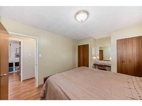 9216 Allison Drive Se, Calgary, AB - Indoor Photo Showing Bedroom