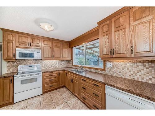 9216 Allison Drive Se, Calgary, AB - Indoor Photo Showing Kitchen With Double Sink