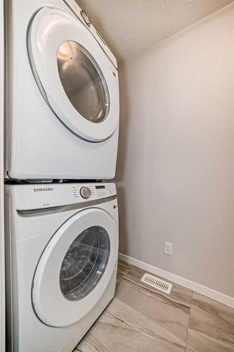 128 Edith Place Nw, Calgary, AB - Indoor Photo Showing Laundry Room