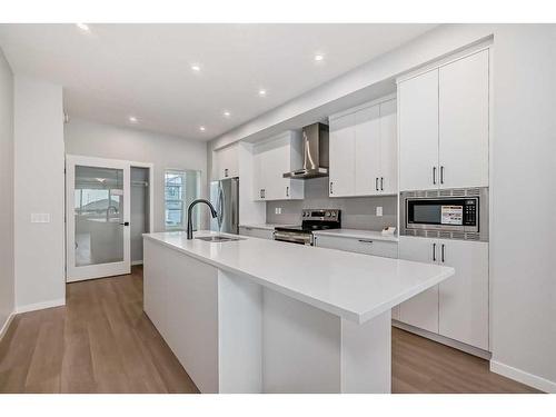 128 Edith Place Nw, Calgary, AB - Indoor Photo Showing Kitchen With Upgraded Kitchen