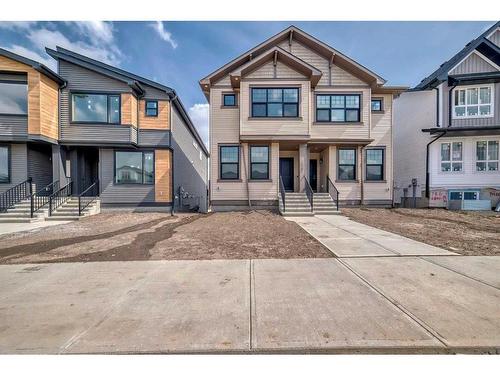 128 Edith Place Nw, Calgary, AB - Outdoor With Facade