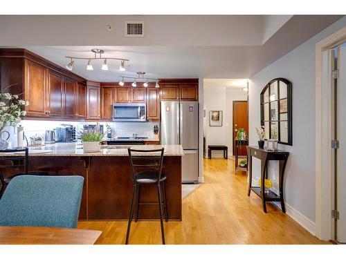 608-910 5 Avenue Sw, Calgary, AB - Indoor Photo Showing Kitchen With Stainless Steel Kitchen