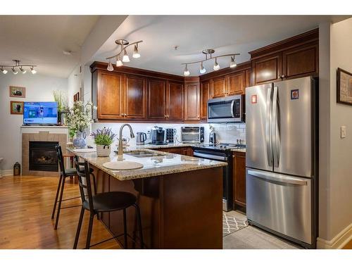 608-910 5 Avenue Sw, Calgary, AB - Indoor Photo Showing Kitchen With Stainless Steel Kitchen