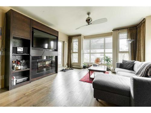 307-1730 5A Street Sw, Calgary, AB - Indoor Photo Showing Living Room With Fireplace