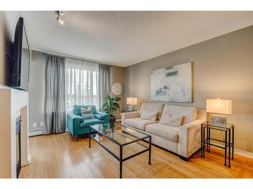 254-35 Richard Court Sw, Calgary, AB - Indoor Photo Showing Living Room With Fireplace