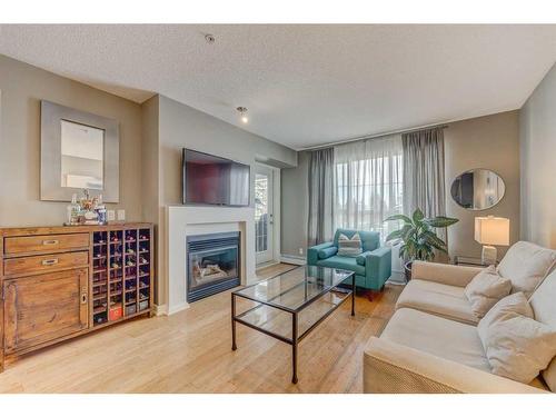 254-35 Richard Court Sw, Calgary, AB - Indoor Photo Showing Living Room With Fireplace