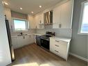 2006 24 Avenue, Didsbury, AB  - Indoor Photo Showing Kitchen With Double Sink 