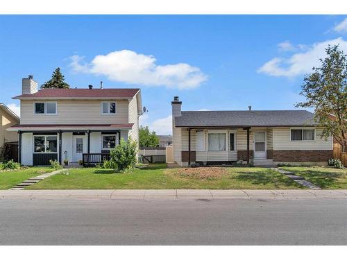 247 & 251 Rundlecairn Road Ne, Calgary, AB - Outdoor With Facade