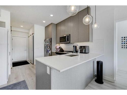 1332-76 Cornerstone Passage Ne, Calgary, AB - Indoor Photo Showing Kitchen With Double Sink With Upgraded Kitchen