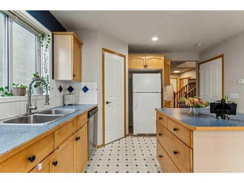 195 Erin Park Drive Se, Calgary, AB - Indoor Photo Showing Kitchen With Double Sink