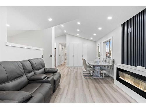 295 Saddlemead Road Ne, Calgary, AB - Indoor Photo Showing Living Room With Fireplace