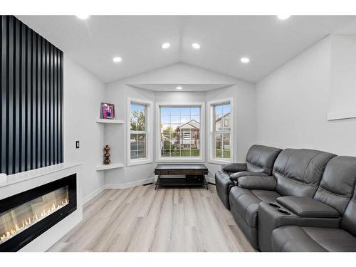 295 Saddlemead Road Ne, Calgary, AB - Indoor Photo Showing Living Room With Fireplace