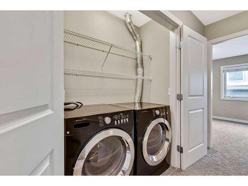 212-1905 27 Avenue Sw, Calgary, AB - Indoor Photo Showing Laundry Room