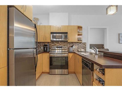 227-69 Springborough Court Sw, Calgary, AB - Indoor Photo Showing Kitchen With Double Sink