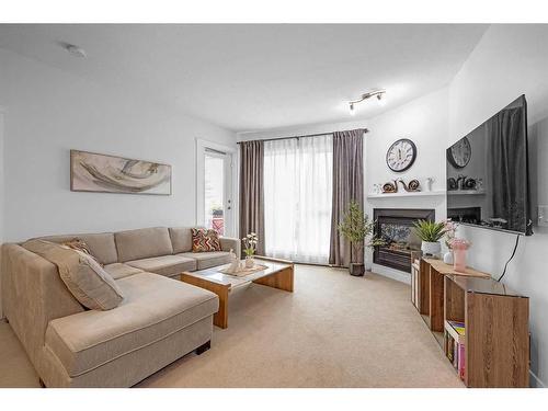 227-69 Springborough Court Sw, Calgary, AB - Indoor Photo Showing Living Room With Fireplace