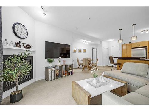 227-69 Springborough Court Sw, Calgary, AB - Indoor Photo Showing Living Room