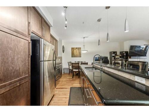 104-41 6A Street Ne, Calgary, AB - Indoor Photo Showing Kitchen With Double Sink With Upgraded Kitchen