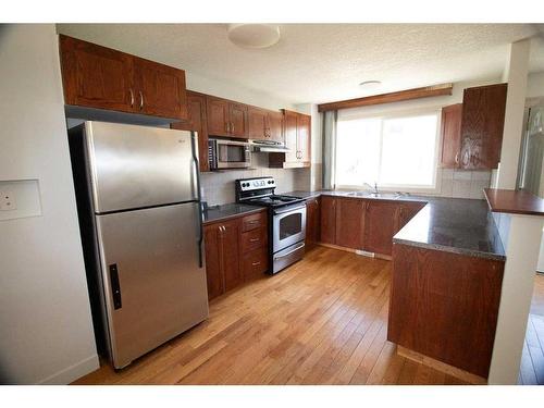 224-2211 19 Street Ne, Calgary, AB - Indoor Photo Showing Kitchen With Double Sink