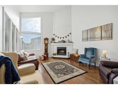 311 Fonda Way Se, Calgary, AB - Indoor Photo Showing Living Room With Fireplace