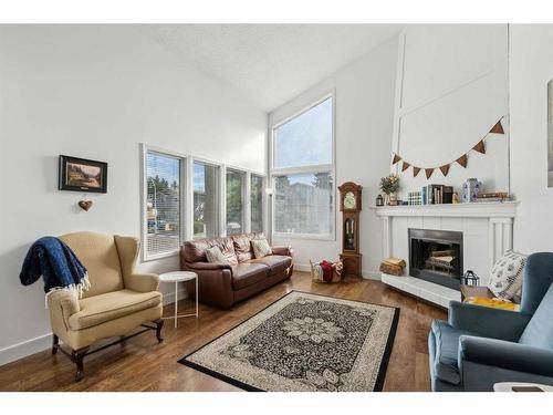 311 Fonda Way Se, Calgary, AB - Indoor Photo Showing Living Room With Fireplace