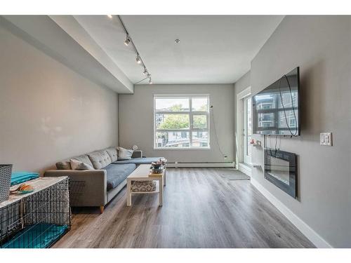 308-515 4 Avenue Ne, Calgary, AB - Indoor Photo Showing Other Room With Fireplace