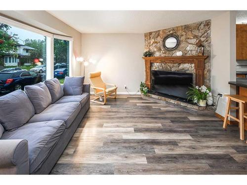 68 Woodglen Close Sw, Calgary, AB - Indoor Photo Showing Living Room With Fireplace