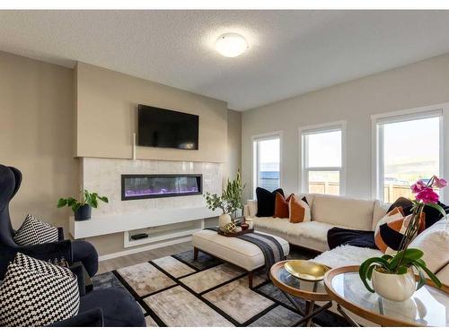 294 Walgrove Boulevard Se, Calgary, AB - Indoor Photo Showing Living Room With Fireplace