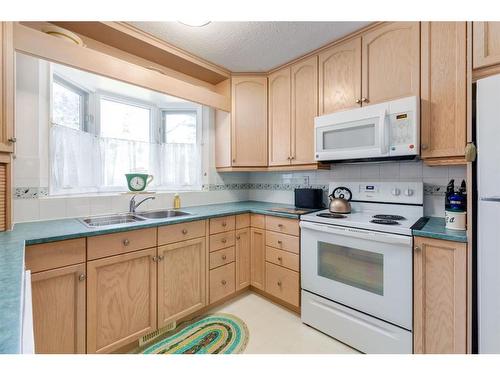 243 Silver Brook Way Nw, Calgary, AB - Indoor Photo Showing Kitchen With Double Sink