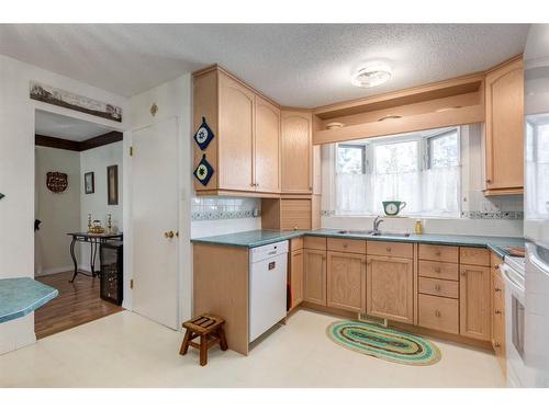 243 Silver Brook Way Nw, Calgary, AB - Indoor Photo Showing Kitchen With Double Sink