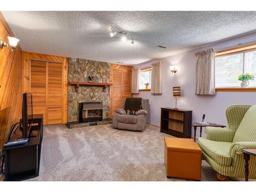 243 Silver Brook Way Nw, Calgary, AB - Indoor Photo Showing Living Room With Fireplace